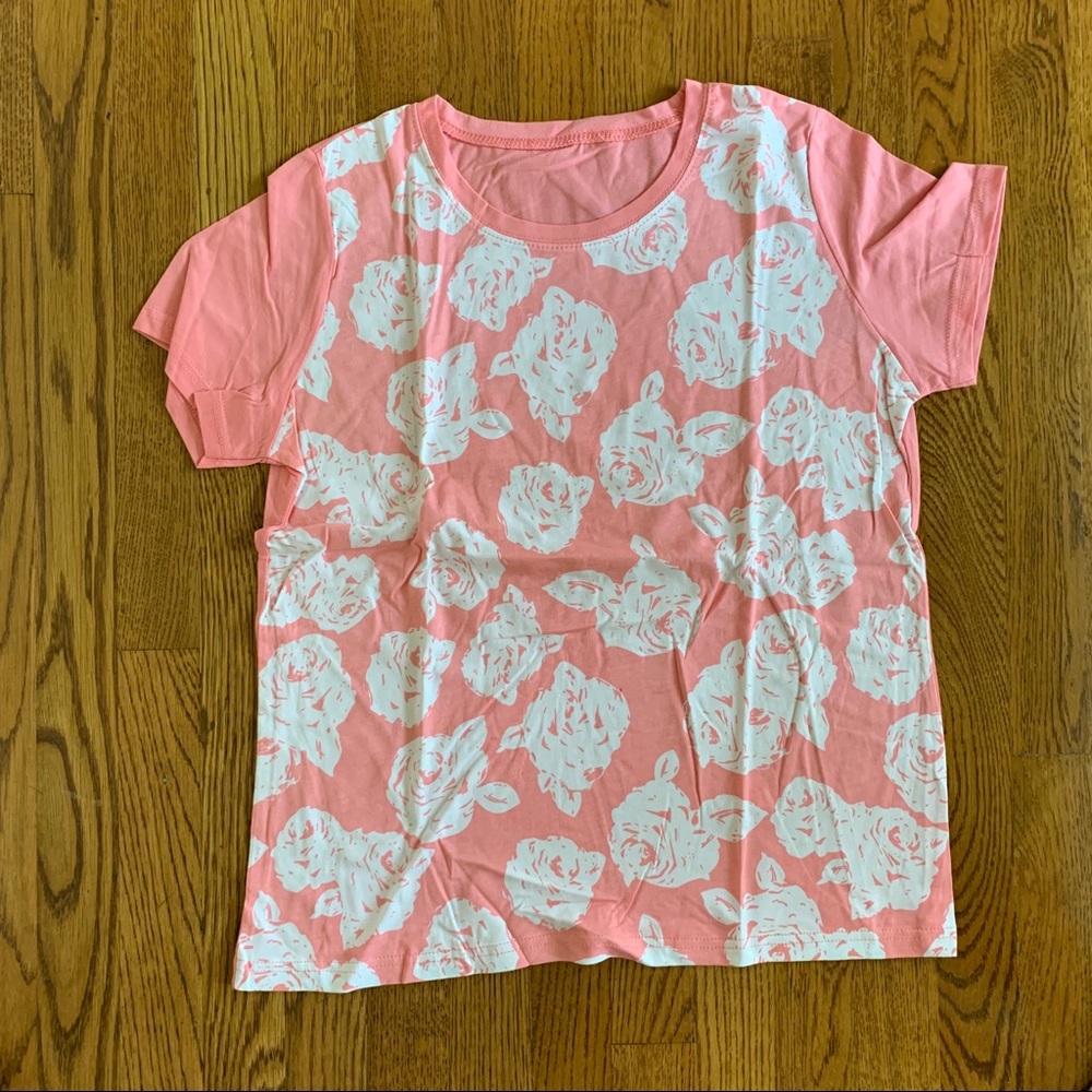 Brand new peach colored T-shirt with design.